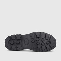 Black Klevas Boys Youth chunky sole loafer with a rugged patterned sole, viewed from directly underneath on a white surface.