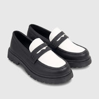 Pair of Klevas Boys Youth chunky sole loafers in black and white leather, with penny loafer strap detail.