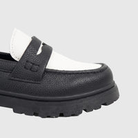 Close-up of a Klevas Boys Youth chunky sole loafer in black and white faux leather, showcasing the textured upper and lugged