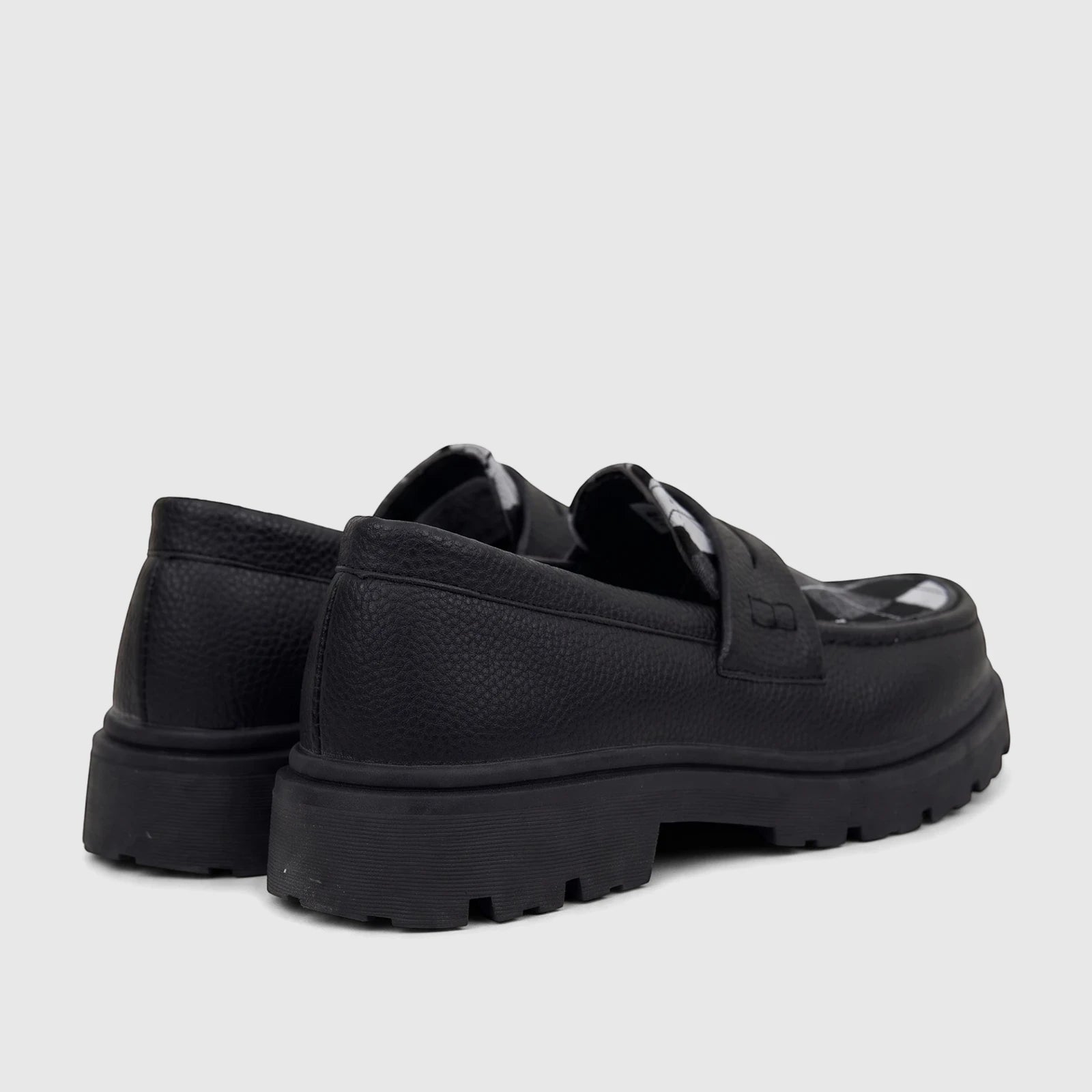 Black Klevas Youth chunky sole loafers with textured upper, viewed from a rear-side angle, showcasing the lug sole.