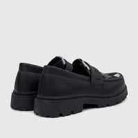 Black Klevas Youth chunky sole loafers with textured upper, viewed from a rear-side angle, showcasing the lug sole.