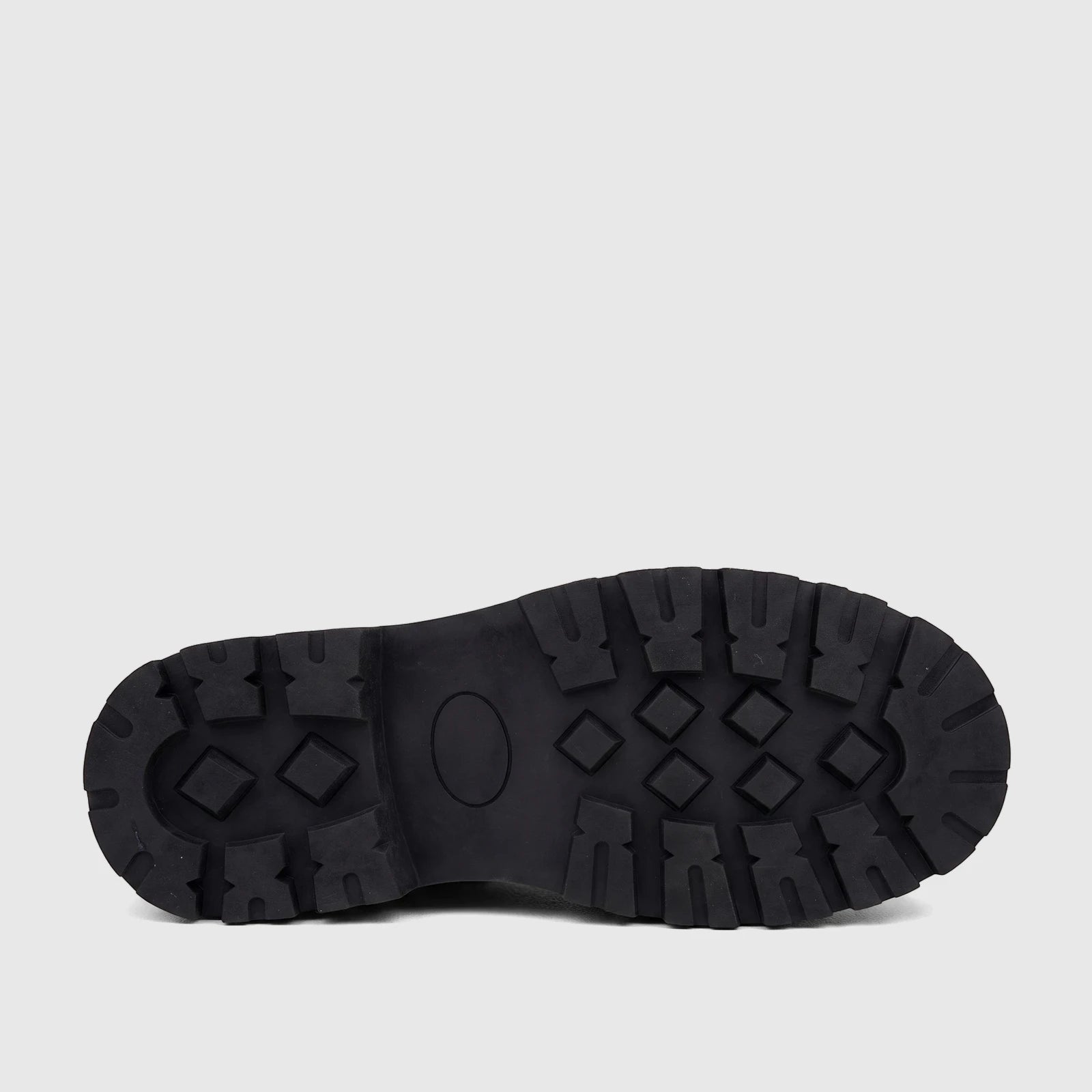 Bottom view of a Klevas Boys Youth chunky sole loafer, showcasing the black rubber sole with deep, rugged tread patterns for