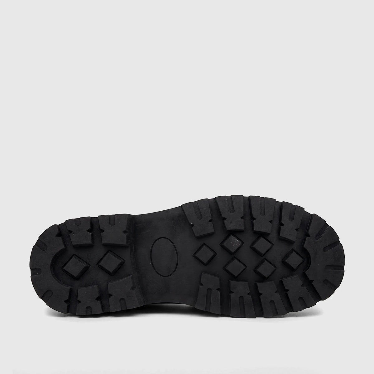 Black chunky sole loafer, showing the bottom sole with a distinct patterned tread and central oval detail.