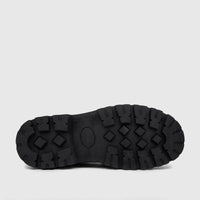 Black chunky sole loafer, showing the bottom sole with a distinct patterned tread and central oval detail.