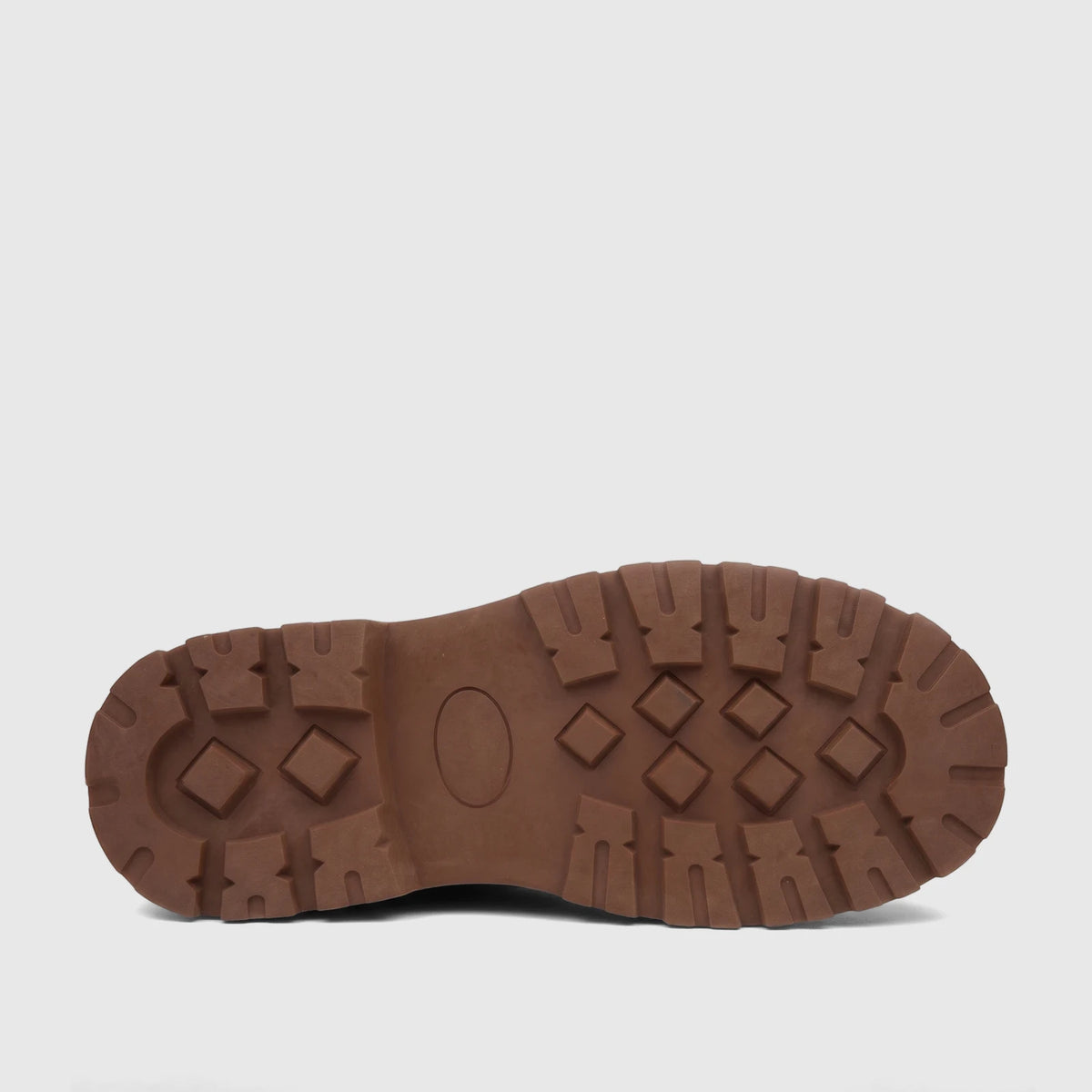 View of a Klevas Boys Youth chunky sole loafer in bowling tan, showcasing the distinct patterned tread of the rubber sole.