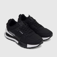 Pair of Klevas men's casual black sneakers with white soles and black laces, shown from a slightly elevated side view.