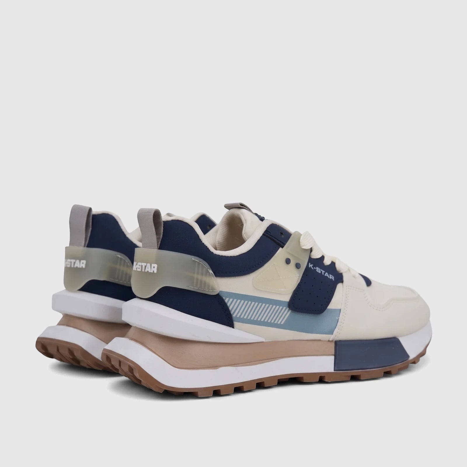 Pair of Klevas Men's Casual Sneaker Ice K7623M shoes in beige and blue with a chunky sole, viewed from a rear-side angle.
