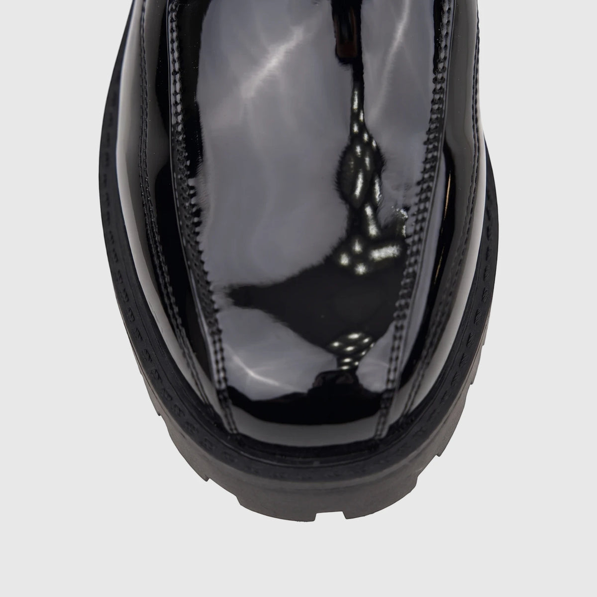 Close-up top view of a Klevas Men's Chunky Sole Loafer Addison K8069M in black patent leather, showcasing its glossy finish