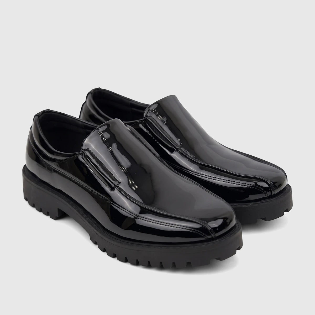 A pair of Klevas Men's Addison chunky sole loafers in black patent leather, viewed from a slight angle.
