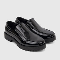 A pair of Klevas Men's Addison chunky sole loafers in black patent leather, viewed from a slight angle.