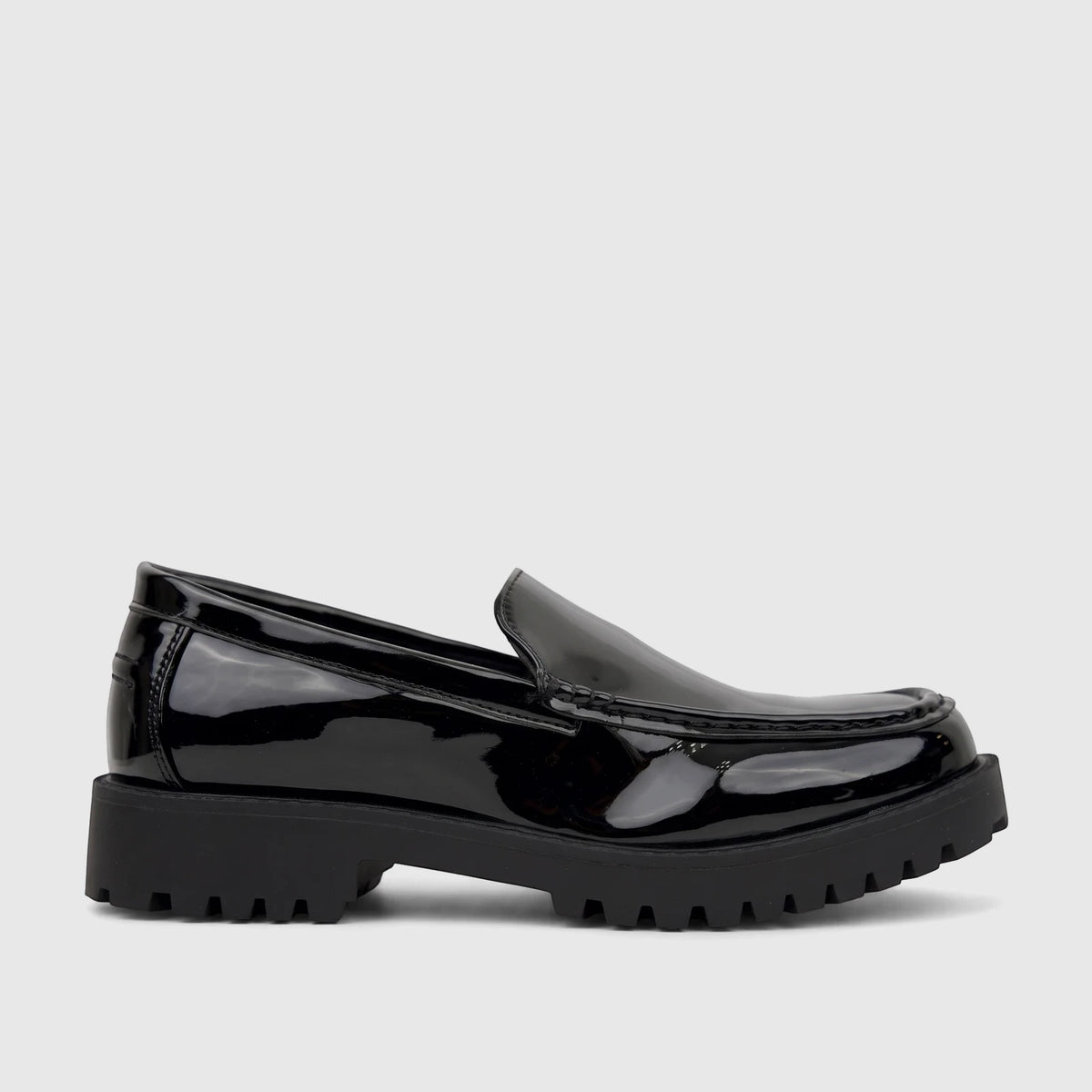 Black patent chunky sole loafer for men from Klevas, shown in a side profile view, highlighting its glossy finish and lug