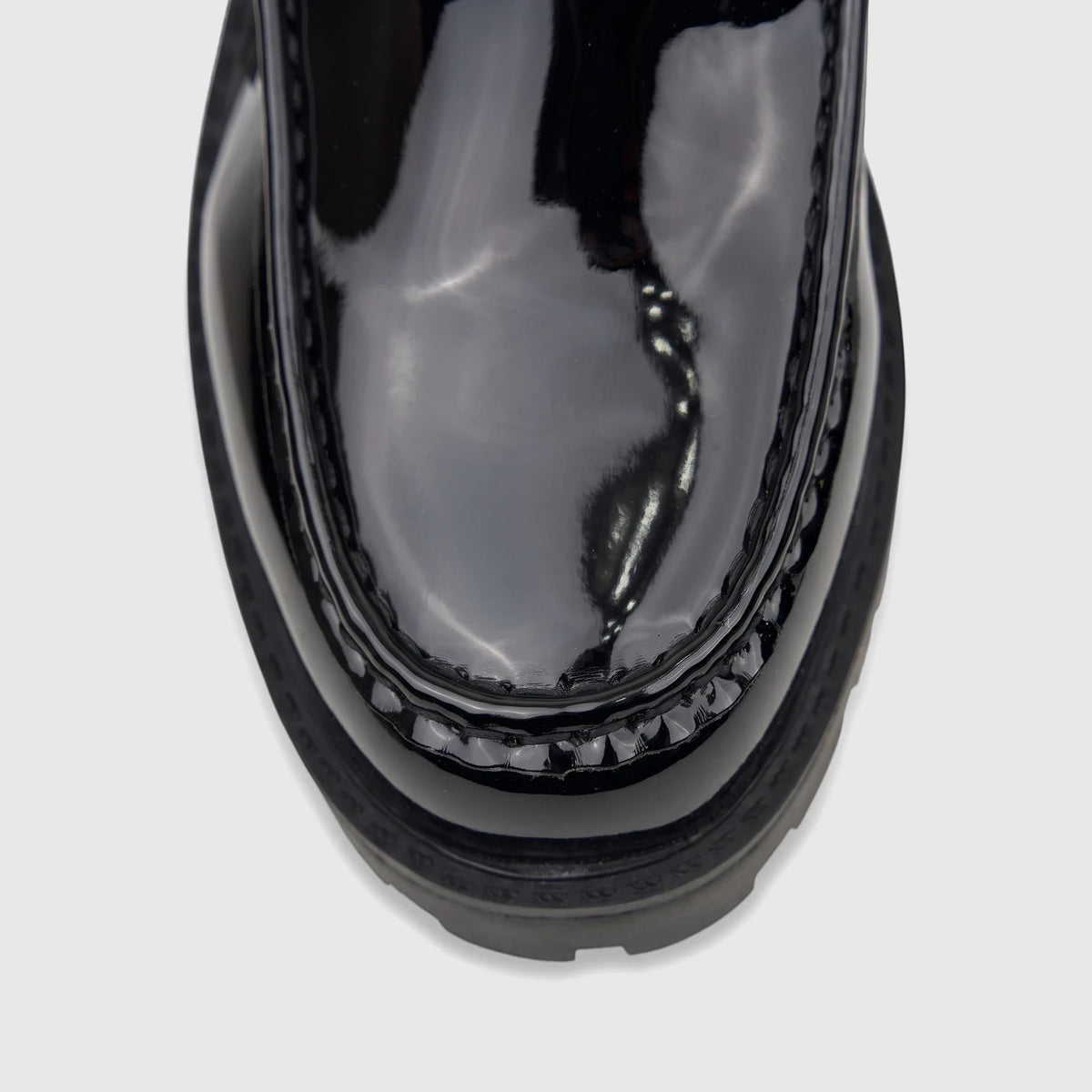 Close-up of a Klevas Men's Chunky Sole Loafer Bass K8196M. Black patent leather loafer with distinct stitching and a chunky