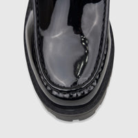 Close-up of a Klevas Men's Chunky Sole Loafer Bass K8196M. Black patent leather loafer with distinct stitching and a chunky