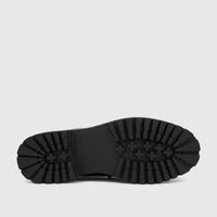 Underside view of a Klevas Men's Chunky Sole Loafer in black patent leather, showcasing the deep-treaded sole pattern.