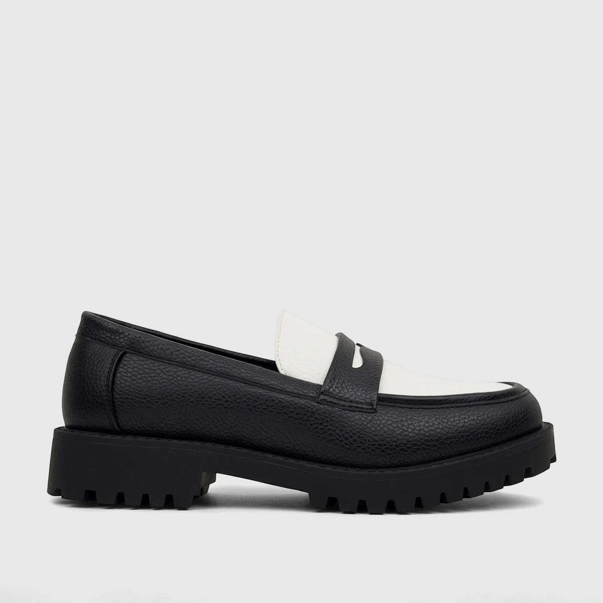 Klevas men's chunky sole loafer in black and white textured leather with a lug sole, shown in a side profile.