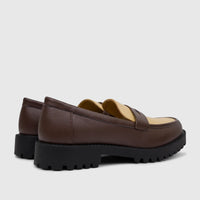 A pair of Klevas Men's Chunky Sole Loafers in brown and beige with black lug soles, viewed from the rear-side.