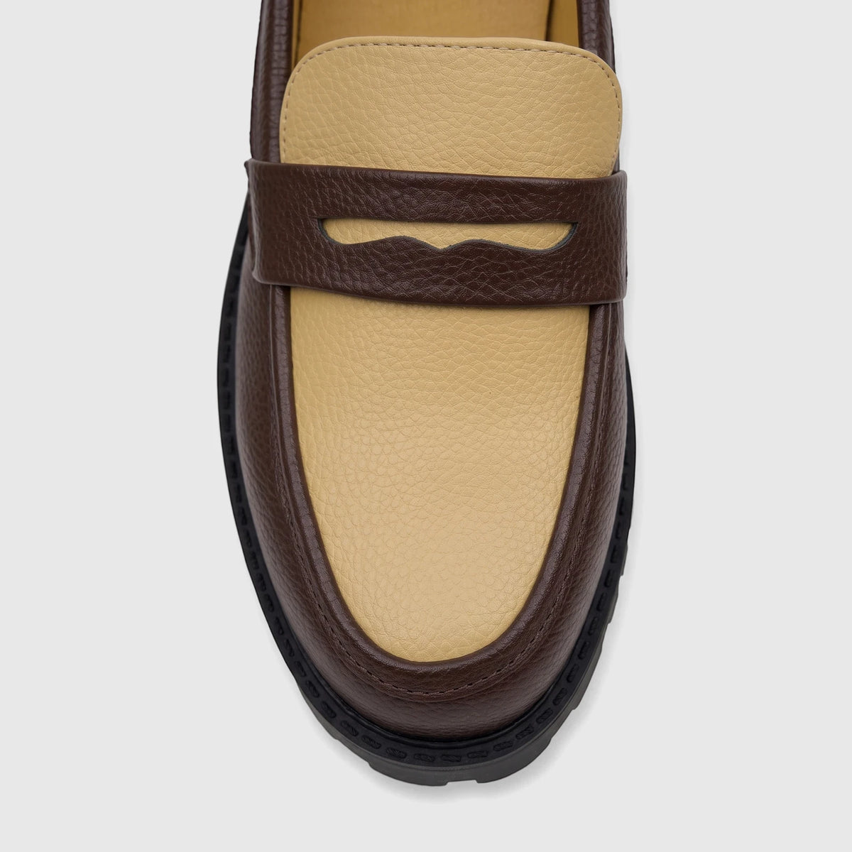 Close-up front view of a Klevas men's chunky sole loafer in brown and beige textured leather.