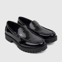 Pair of Klevas Men's chunky sole loafers in black patent leather, showcasing the shiny finish and lugged platform soles.
