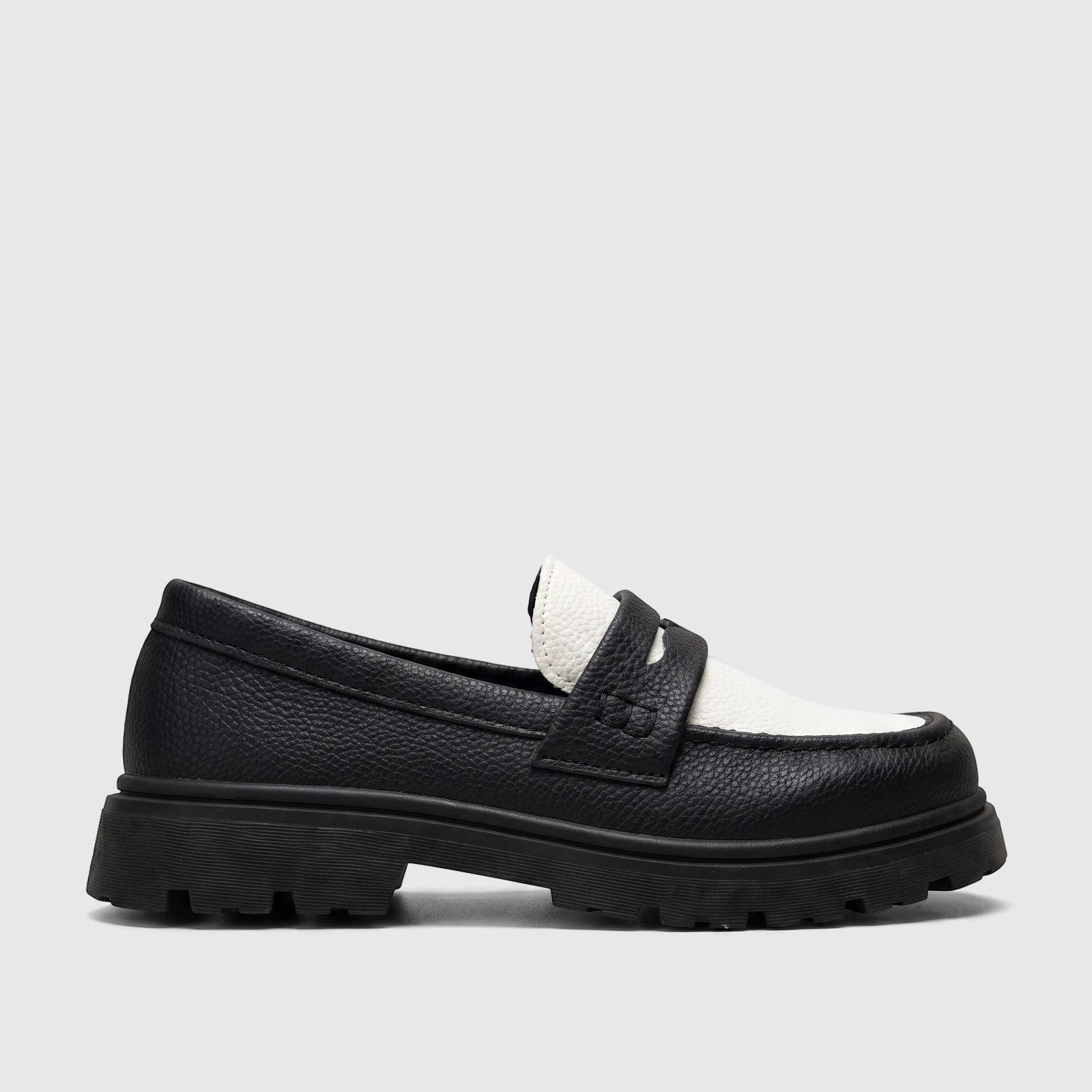 Black and white Klevas Youth chunky sole loafer with a classic saddle strap, shown in a side profile view.