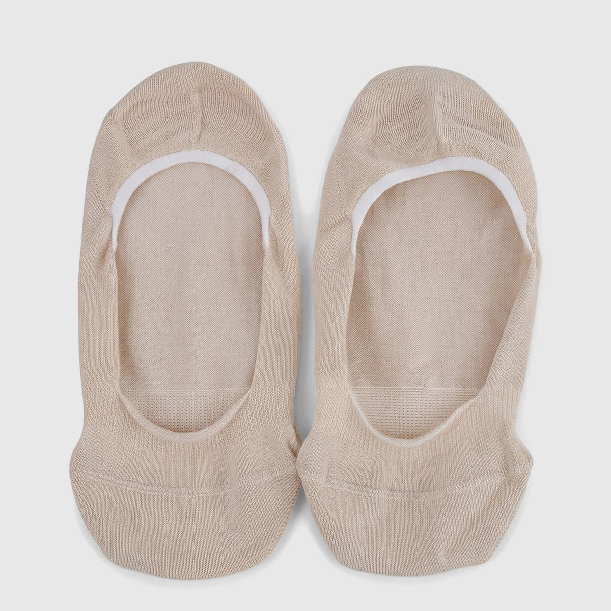 A pair of beige ladies' bamboo invisible socks, flat lay, showcasing their knitted texture and low-cut design.