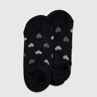 Pair of ladies black bamboo invisible socks featuring subtle gray heart patterns, displayed flat-lay on a surface.
