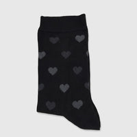 Black bamboo ladies' sock featuring a subtle grey heart pattern, displayed flat against a white background.