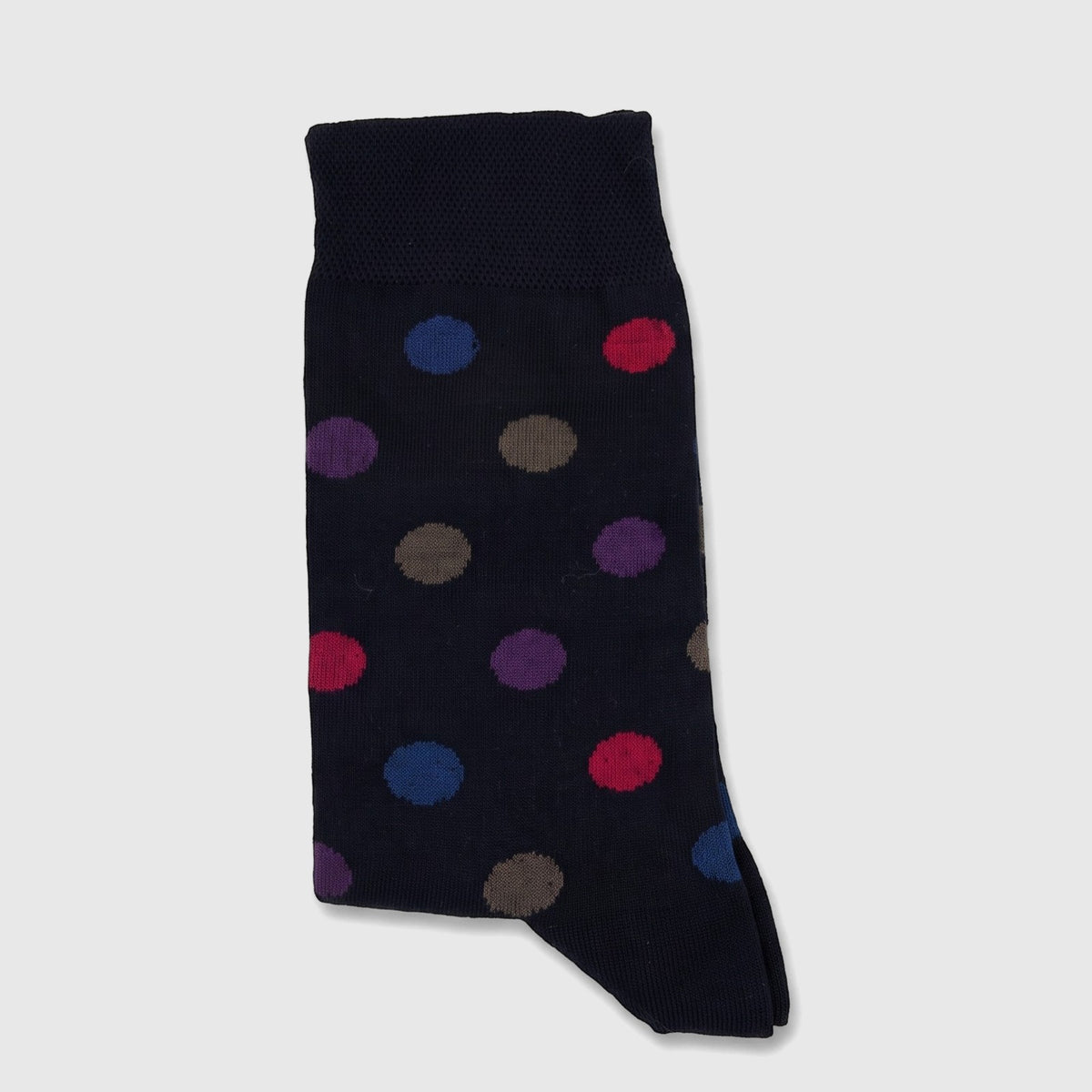 Ladies navy pure cotton socks with multicolored polka dot pattern in a flat lay studio shot.