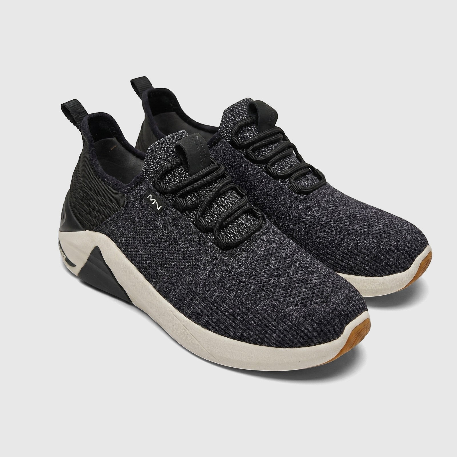 Pair of Mark Nason X Skechers women's comfort sneakers in black and grey knit fabric, visible from a slight overhead angle.