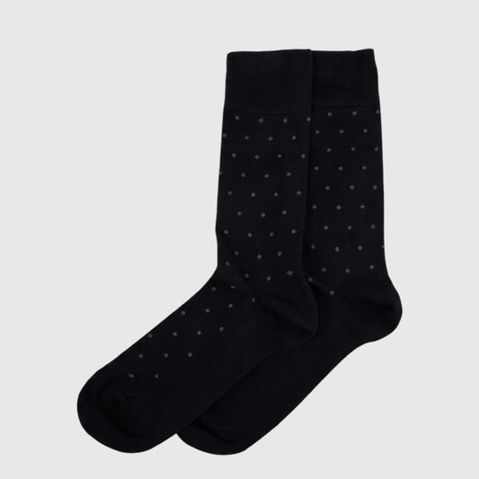 Men's black Micro Modal socks with white polka dots, folded and displayed in packaging, size UK6 to UK11.