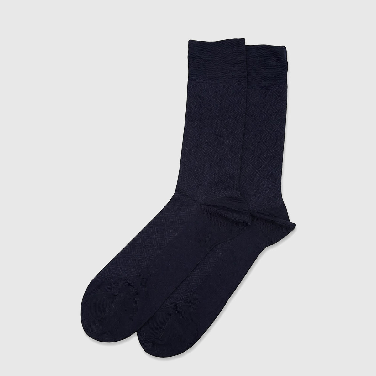 Pair of men's navy micro modal socks with a subtle diamond pattern, displayed flat. Comfortable and stylish.