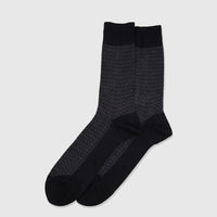 Pair of men's black and grey mercerised cotton socks with a subtle patterned texture, laid flat.