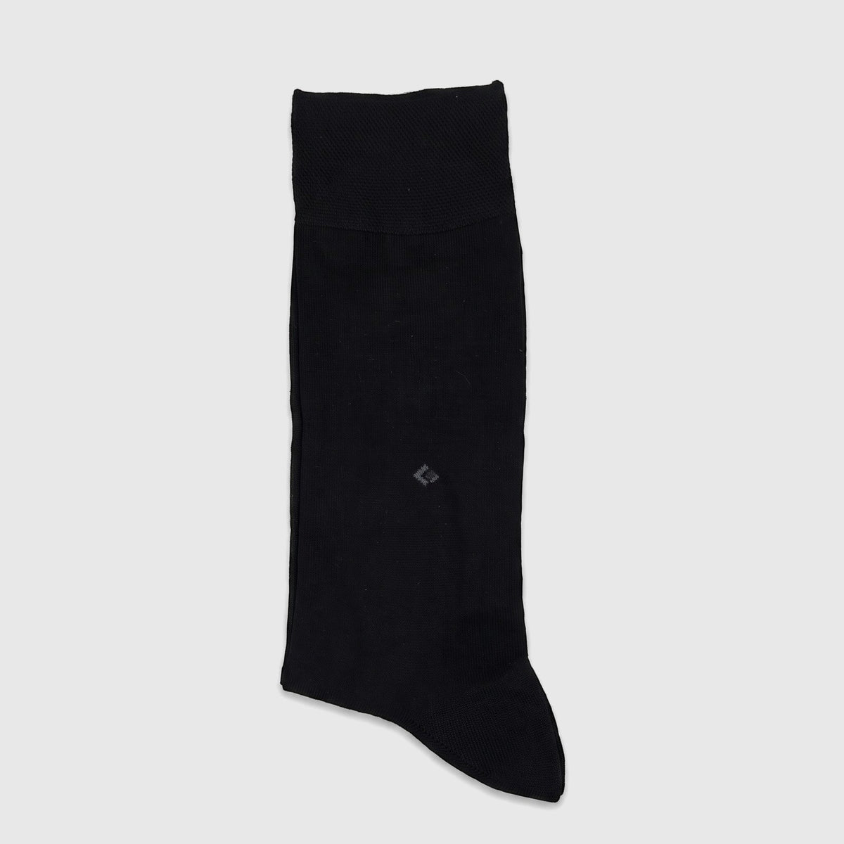 Single black men's micro modal dress sock, featuring a fine knit texture and subtle branding detail, displayed in a flat lay.