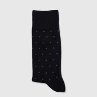 Men's black Micro Modal socks with white polka dots, folded and displayed in packaging, size UK6 to UK11.