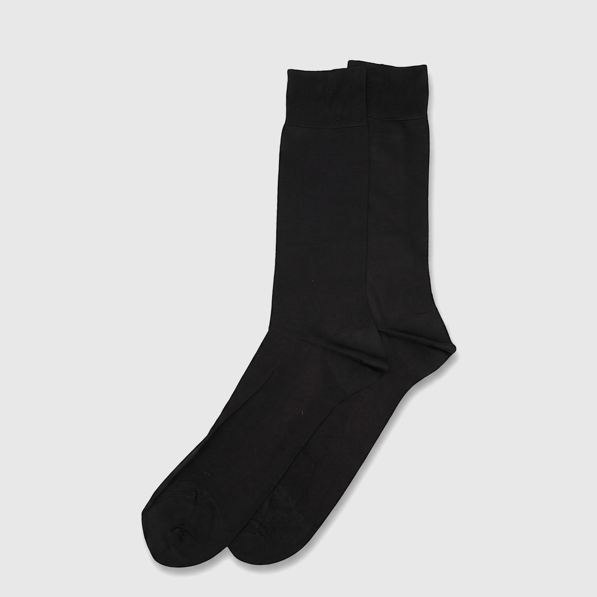 A pair of men's black rayon floss dress socks, folded neatly and displayed in a flat-lay arrangement from a top-down view.