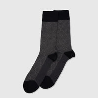 Men's Mercerised Bamboo Socks in black and grey, featuring a subtle diamond pattern and comfortable fit, displayed flat.