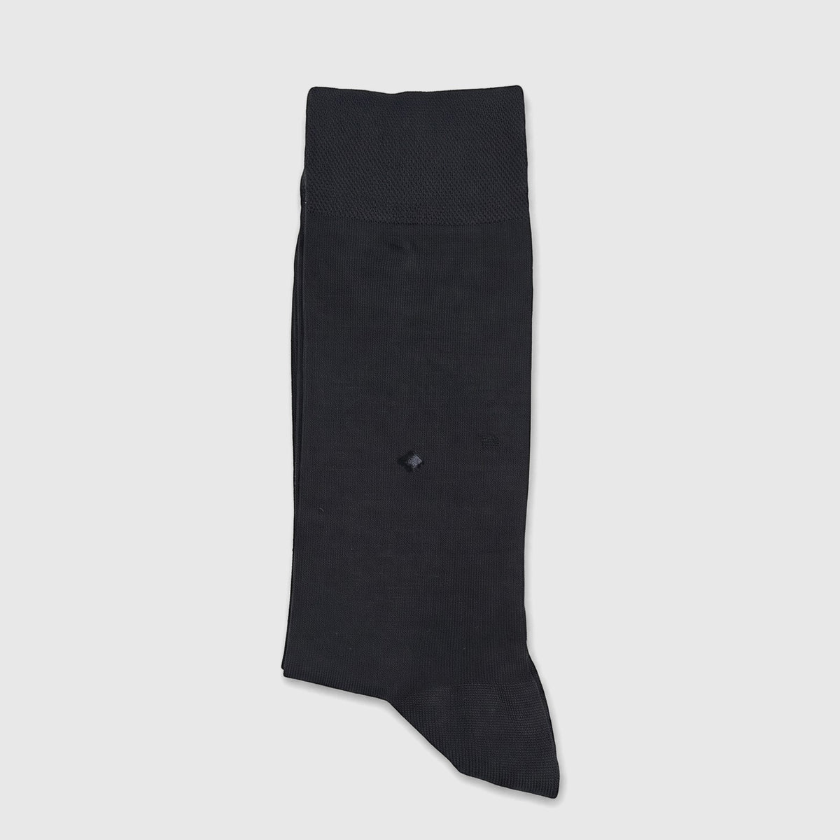 A single black men's micro modal sock, featuring a small diamond-shaped hole, displayed flat on a white surface.