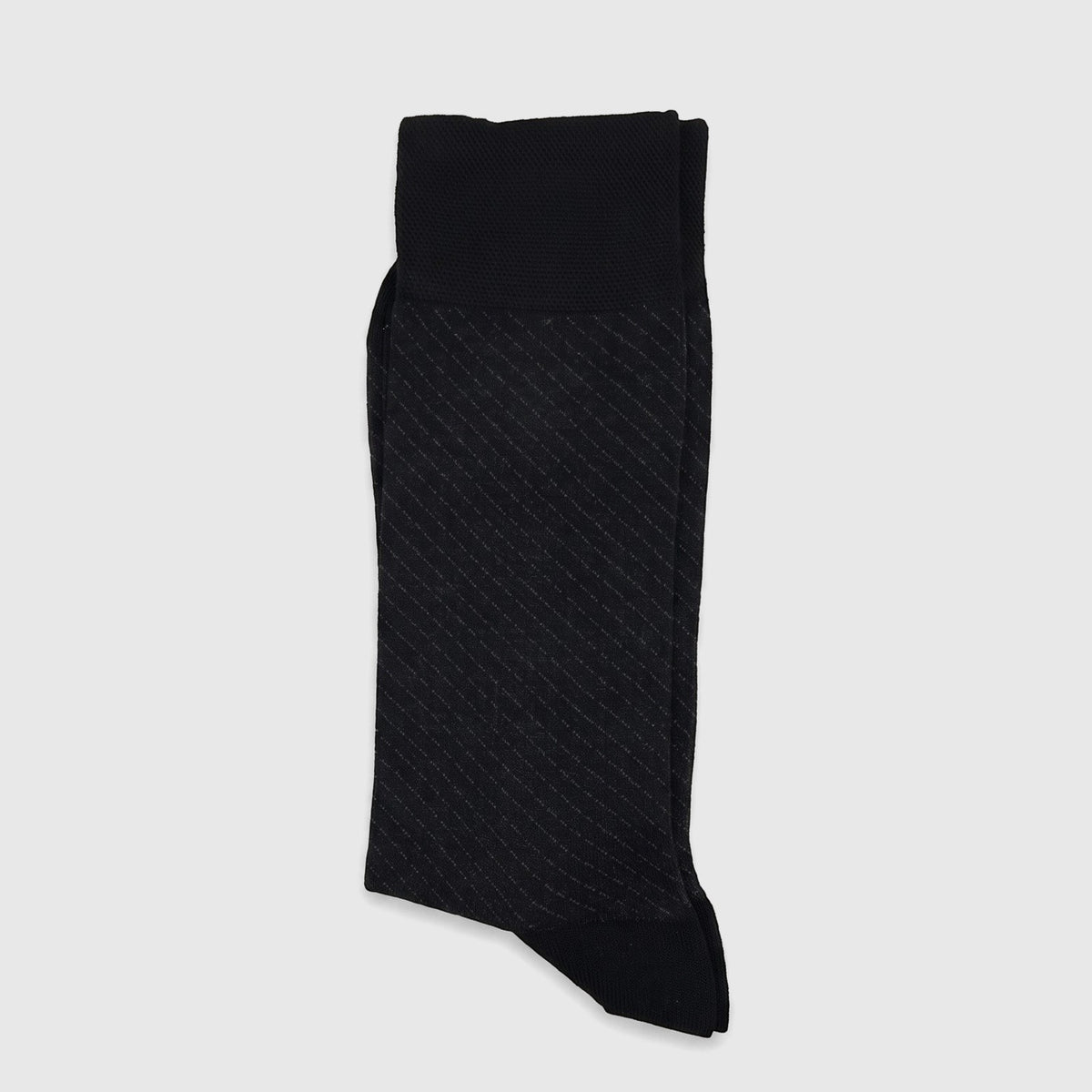 A folded black men's micro modal sock with a subtle diagonal pattern, showcasing its soft texture and ribbed cuff.