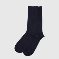 A pair of men's navy green micro modal socks with a subtle green polka dot pattern, neatly folded and laid flat on a surface.