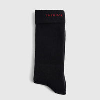 A single black Men's Thermal Sock, made of a warm knit fabric, displayed flat against a plain background.