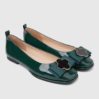 Morbido Ladies Dark Green Patent Leather Ballet Flats with Decorative Clover Buckles, shown from a slightly elevated view.