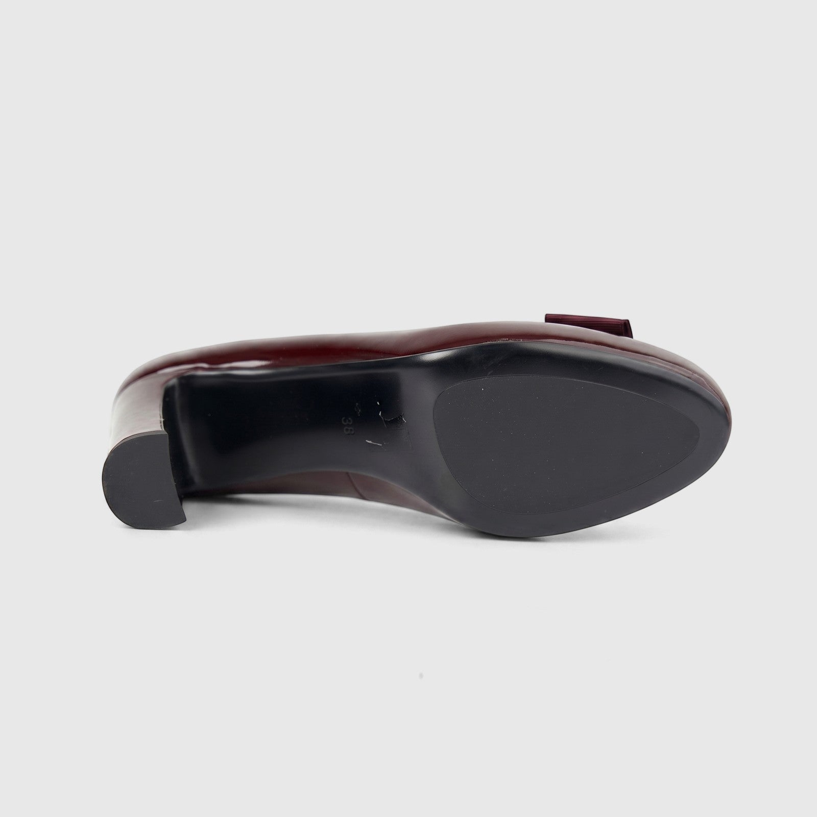 Morbido ladies wine red leather dress court shoe with a block heel, shown from a bottom view revealing the black sole and