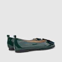 A pair of Morbido Ladies Leather Pump BIL-026 in dark green patent leather with decorative bows and gold buckles, shown from