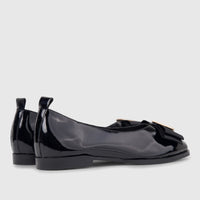 Morbido Ladies Leather Pump BIL-025 in black patent leather, featuring a bow and gold buckle, shown from a side view.