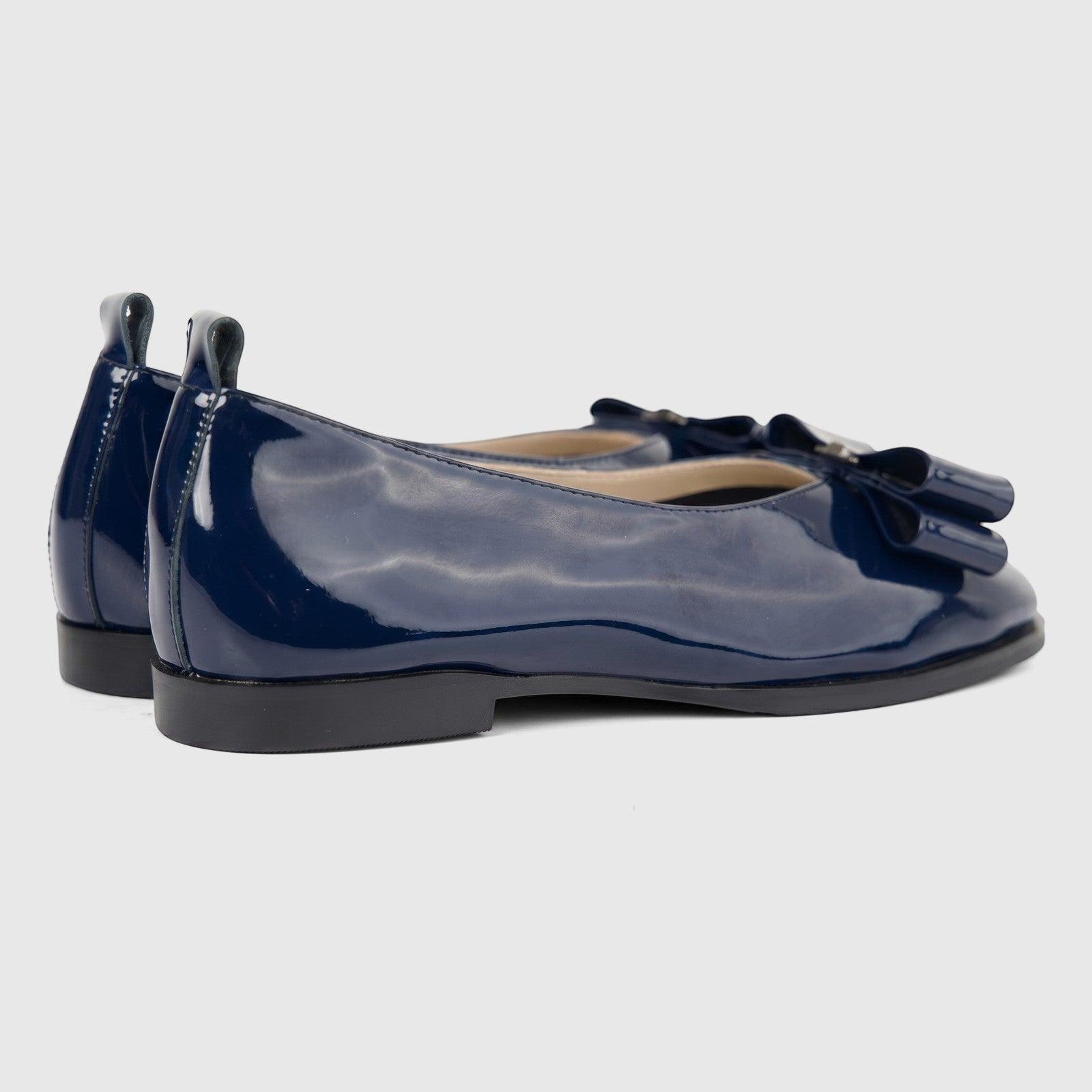 Morbido Ladies Leather Pump BIL-020 in dark blue patent leather, featuring a flat sole and decorative bow, shown from a