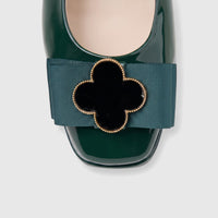 Morbido Ladies Leather Pump in dark green patent leather, featuring a teal grosgrain ribbon and a decorative clover buckle.