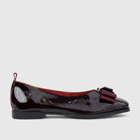 Morbido Ladies Leather Pump in wine red patent leather with a decorative bow on the vamp and a low block heel, viewed from