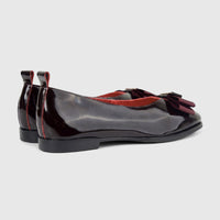 Morbido Ladies Leather Pump in wine red patent leather, featuring a bow detail and red stitching, shown from a side-rear
