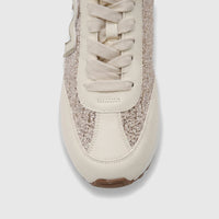 Close-up of a Morbido ladies' leather sneaker in beige, featuring glitter side panels and cream laces in a front-top view.
