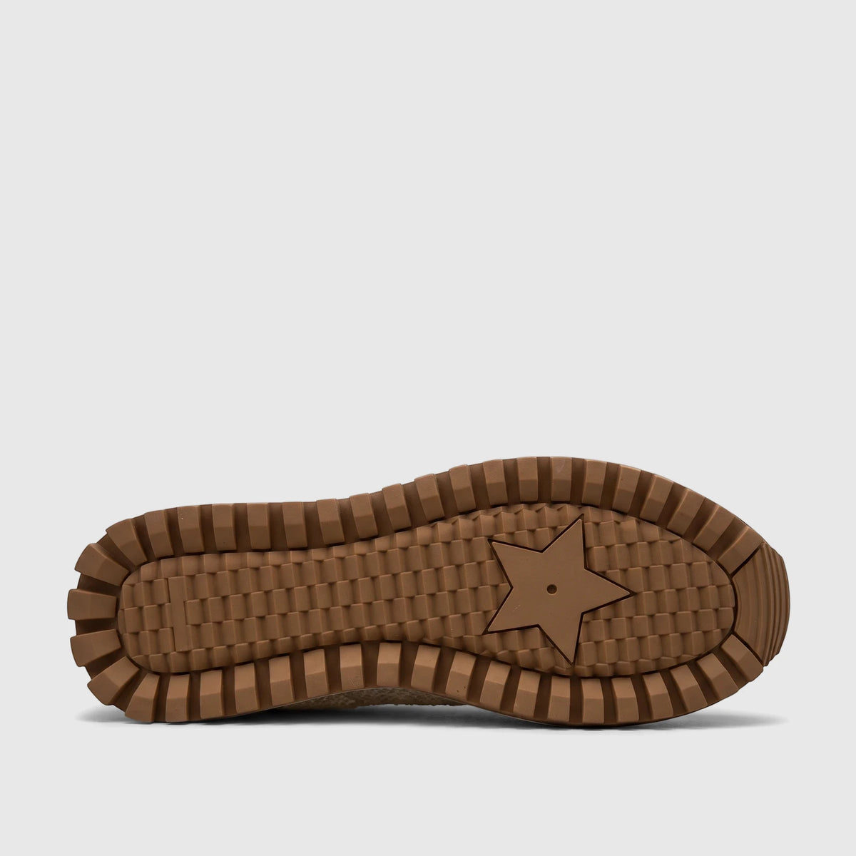 Morbido Ladies Leather Sneaker beige sole with a textured brown rubber pattern and a central star design.
