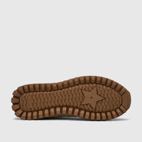 Morbido Ladies Leather Sneaker beige sole with a textured brown rubber pattern and a central star design.